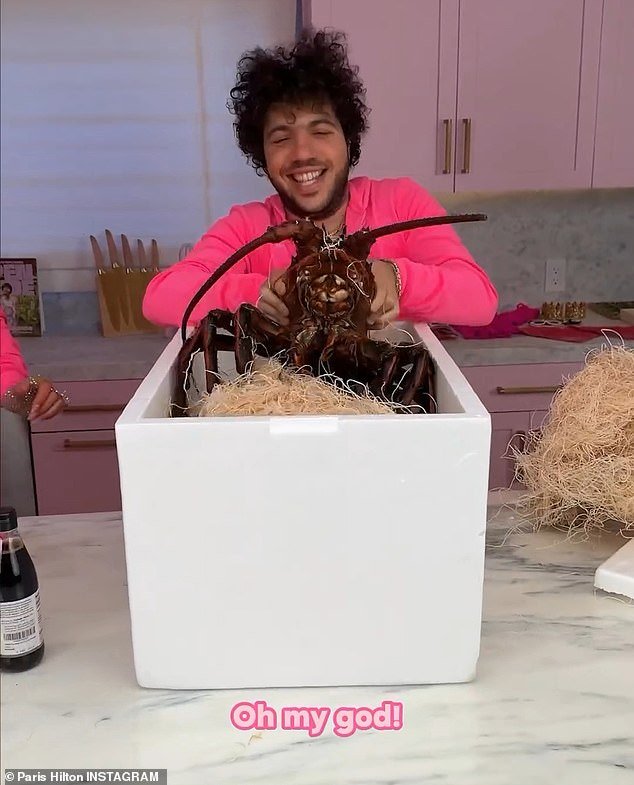 Benny opened a box containing the lobster and said, 'I have the largest lobster in the world.  Oh my God!'