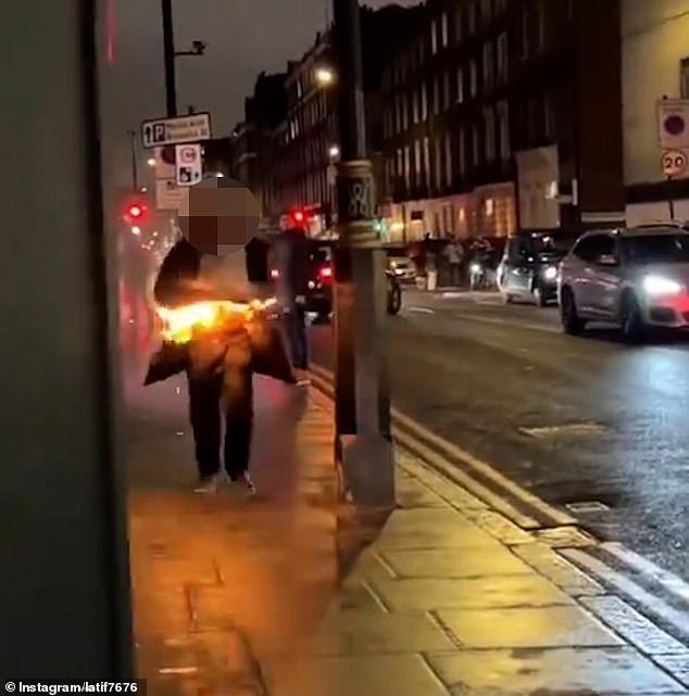 This is the shocking moment a burning man runs down a London street