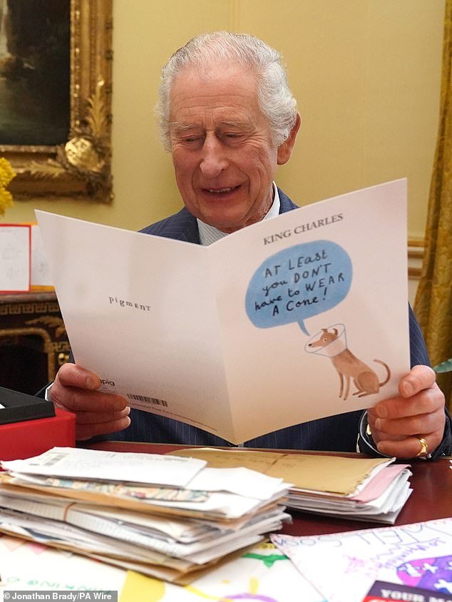 The royal family has released photos and videos of King Charles reading cards sent to him by well-wishers following his cancer diagnosis.  Pictured: His Majesty reading a card at Buckingham Palace