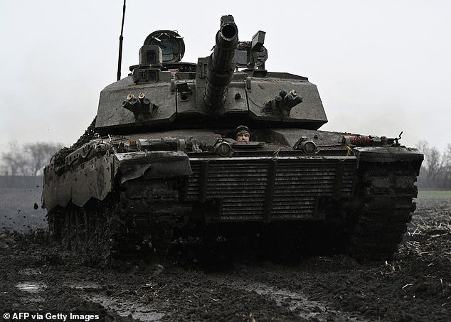 A Ukrainian soldier from the 82nd Separate Air Assault Brigade prepares for a battle with the Challenger 2 tank