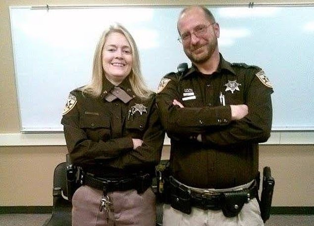 Jenn with a colleague at the Campbell County Sheriff's Department, where she spent her career as a detention officer