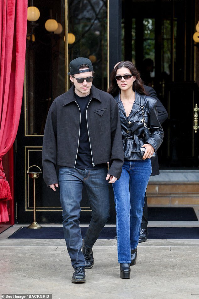 David and Victoria's eldest son wore a structured black jacket with a plain T-shirt and dark blue jeans