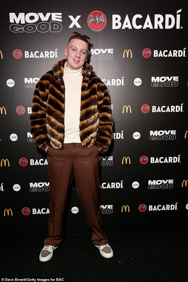 Aitch stood out in a brown fur coat with animal print