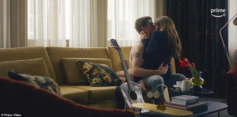 Here they kiss like teenagers on a couch next to his guitar