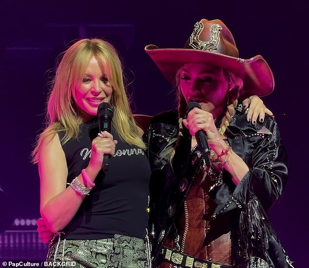 Madonna opted for cowgirl chic and was decked out in a leather jacket and fringed hat that she wore over lingerie