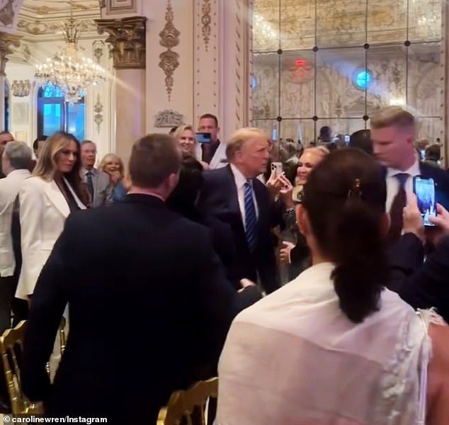 The couple entered to cheers and applause as they walked through the Mar-a-Lago ballroom