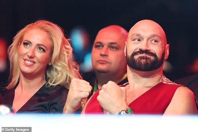 She looked cheerful as she flashed a beautiful white smile and applauded the boxing athletes