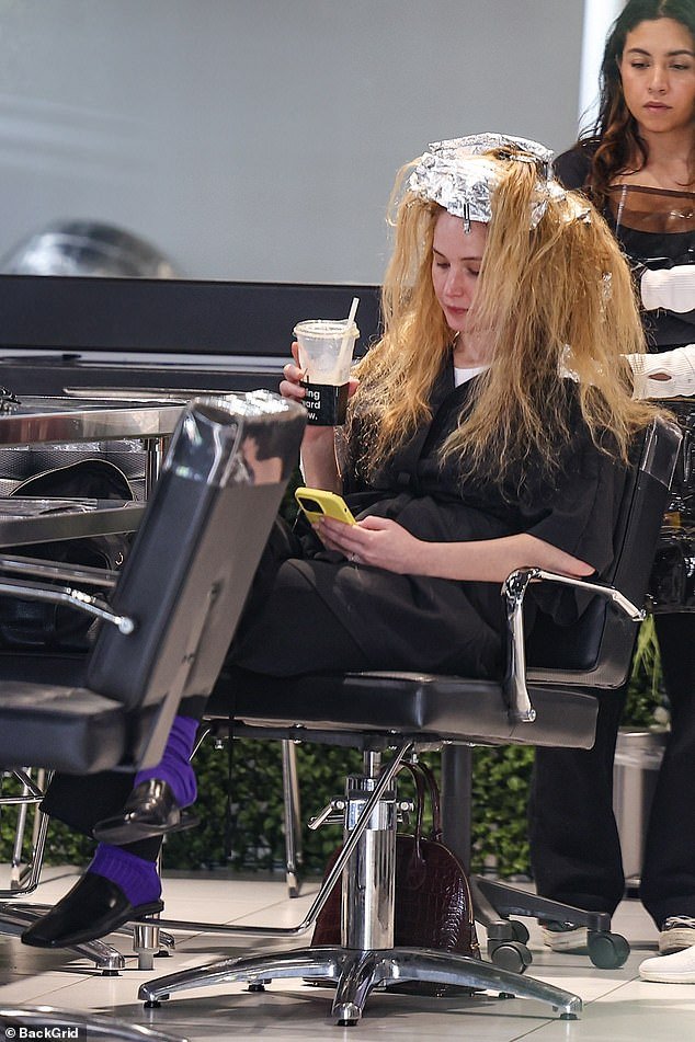 Foil outlined the top of her head as her stylist worked to accentuate the mother of one's long, blonde hair