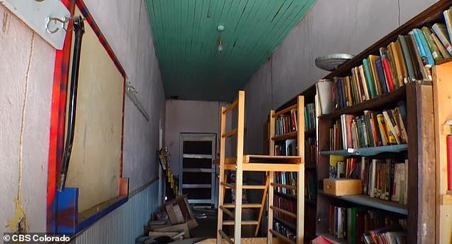 Antique and vintage books lined the shelves of the Garcia school, where the original mud plaster remains
