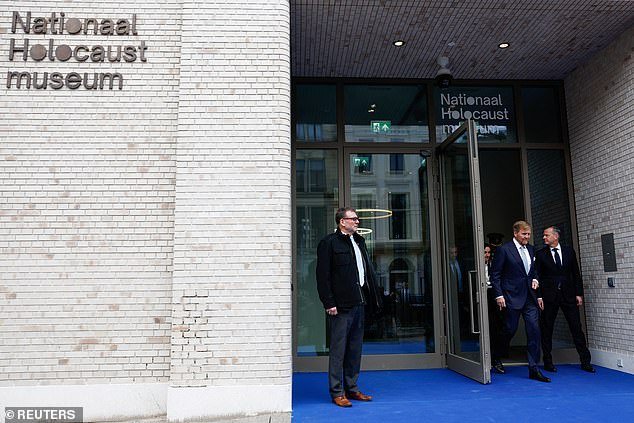 King Willem Alexander walks out of the National Holocaust Museum on the day of its opening