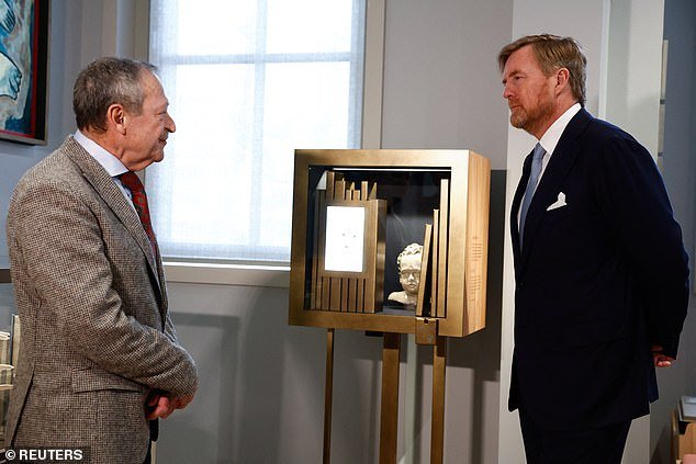 King Willem Alexander receives a tour of the National Holocaust Museum in Amsterdam