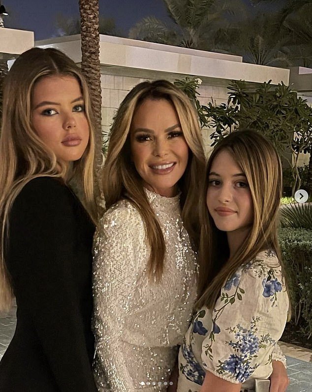 She also posted several Instagram photos with her two look-alike daughters, Lexi, 18, and Hollie, 12, calling motherhood 