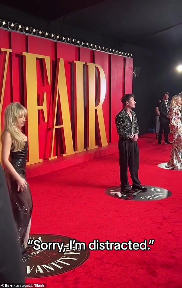 While posing side by side on the red carpet, Barry apologized to photographers for continually looking to his right at Sabrina: 'Sorry, I'm distracted'