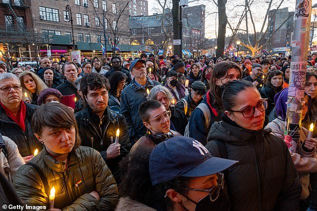 People gather outside the Stonewall Inn for a memorial and vigil for the Oklahoma teen who died after a fight in a high school bathroom