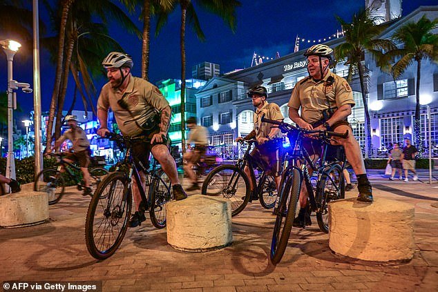 Police patrol the streets on their bikes in South Beach, Florida