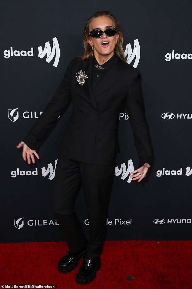 The artist opted for a black double-breasted suit, paired with a black button-up underneath