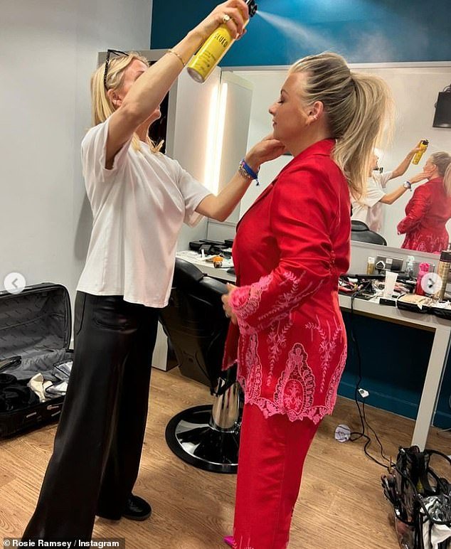 She swept her blonde locks back into a high ponytail as she shared a behind-the-scenes photo of an intense hair spray