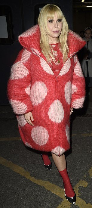 Paloma wore a big, furry red zip-up coat with pink polka dots and paired it with black shoes with white polka dots