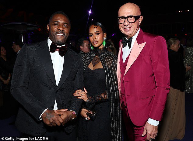 Actor Idris Elba, Sabrina Dhowre Elba and Gucci CEO and President Marco Bizzarri - all wearing Gucci - are pictured at the 2022 LACMA ART+FILM GALA presented by Gucci at the Los Angeles County Museum of Art on November 5, 2022