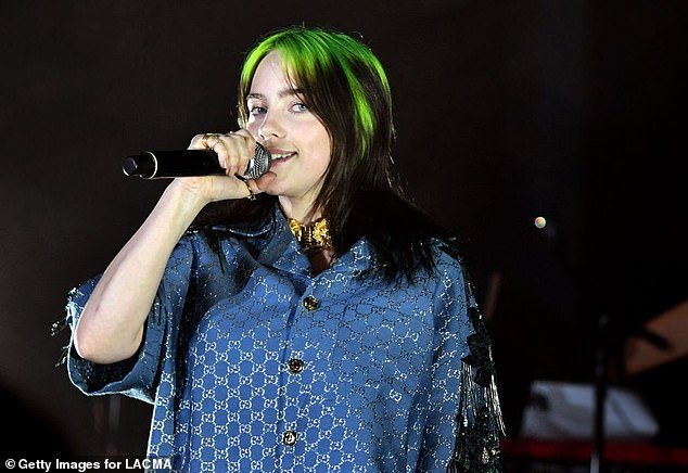 Billie Eilish wears Gucci and speaks on stage at the 2019 LACMA Art + Film Gala Presented by Gucci at LACMA on November 2, 2019 in Los Angeles, California