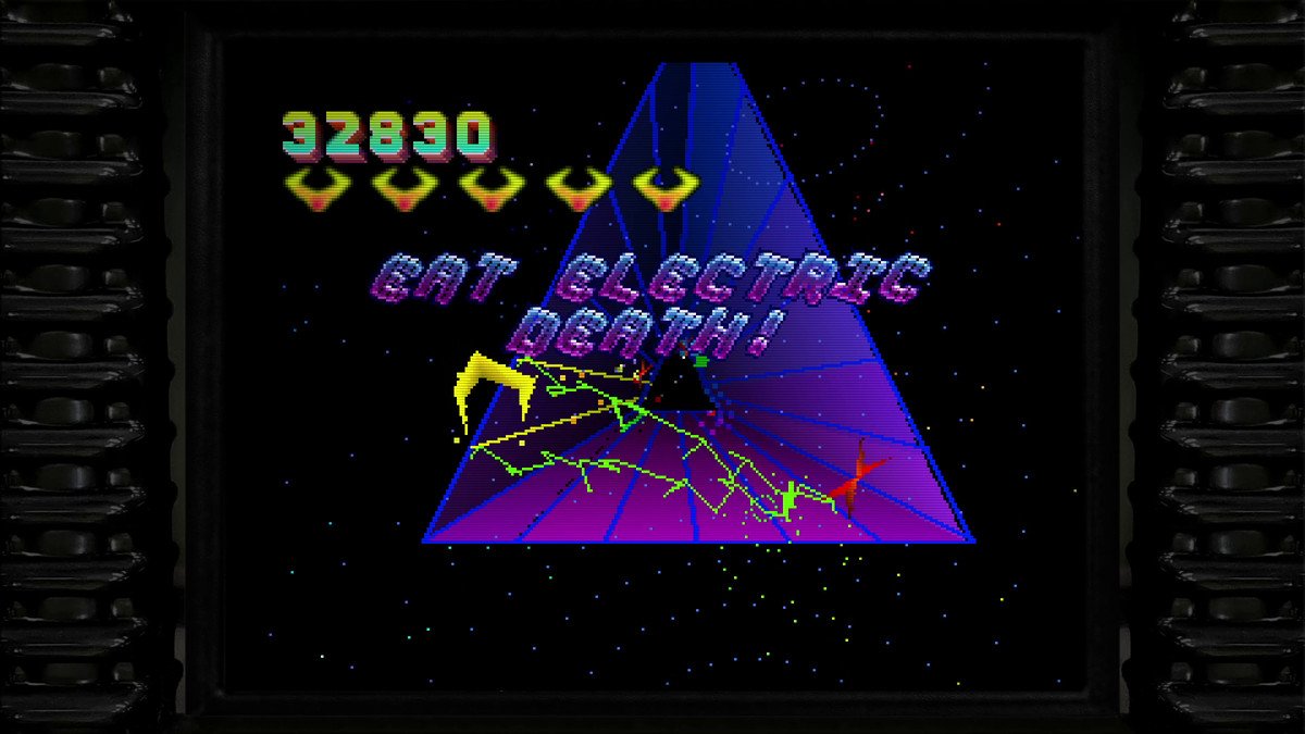 A screenshot from Tempest 2000 - lightning crackles through a triangular purple tunnel as distorted writing reads EAT ELECTRIC DEATH!