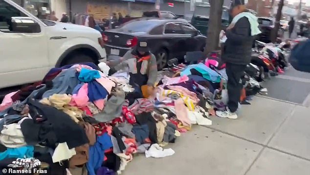 Vendors can be seen lining the streets with piles of clothing next to them, while others sell sneakers, toys and other miscellaneous items