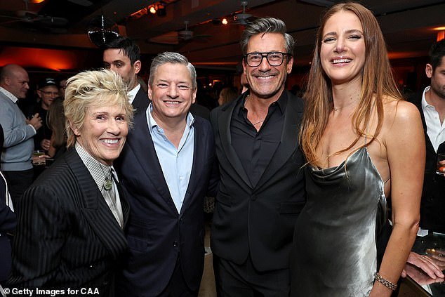 From left to right: Author Diana Nyad, Netflix CEO Ted Sarandos, actor Jon Hamm and his wife Anna Osceola attend the CAA pre-Oscar party at Sunset Tower