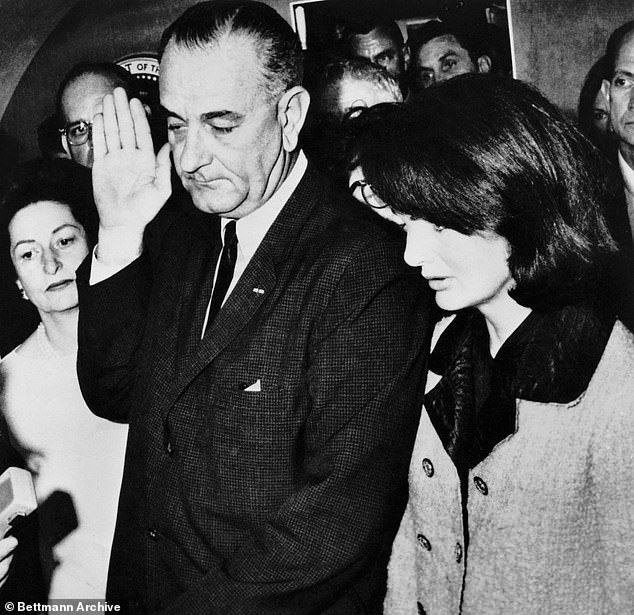 Jackie was spotted wearing the bloody outfit hours later - as Lyndon B. Johnson was sworn in as president (seen)