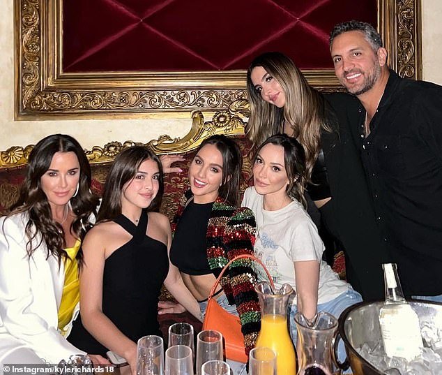 The couple pictured with their three daughters Alexia, 27, Sophia, 24, and 16-year-old Portia, as well as Kyle's eldest daughter Farrah, 36