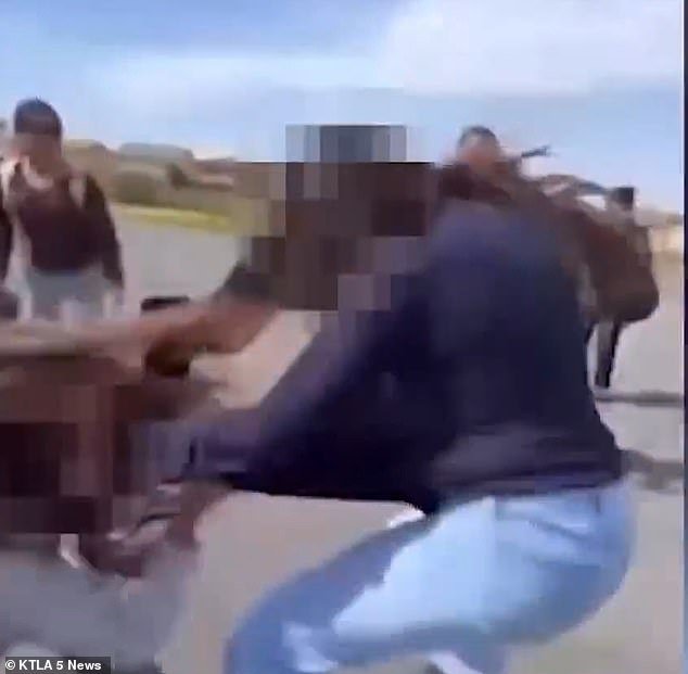 The victim could be seen clinging to the other girl's sweater in an attempt to stop the attack