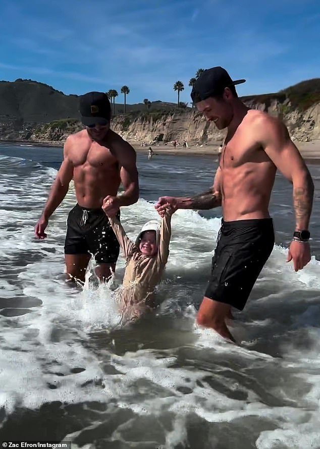 1710889793 448 Zac Efron shows off washboard abs and RIPPED physique while