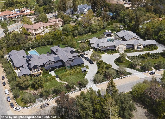 Kris's (L) mansion is next door to daughter Khloe's $17 million home