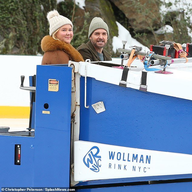 The Trainwreck actress sat next to The Last Man On Earth star in the large vehicle while on an ice skating rink