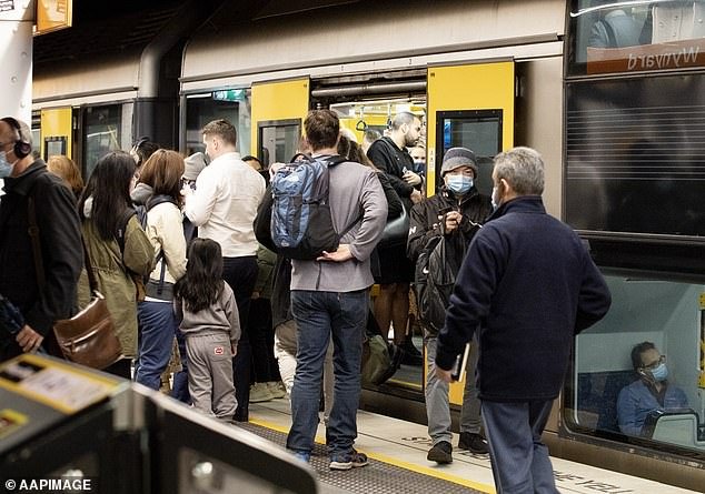 A record number of 518,000 migrants moved to Australia in the last financial year.  Updated figures due on Thursday are expected to show even greater inflows for 2022-2023 (pictured is Sydney's Wynyard train station)