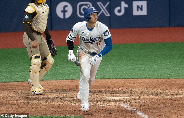 Shohei Ohtani #17 of Los Angeles Dodgers hits a fly ball in the bottom of the seventh inning