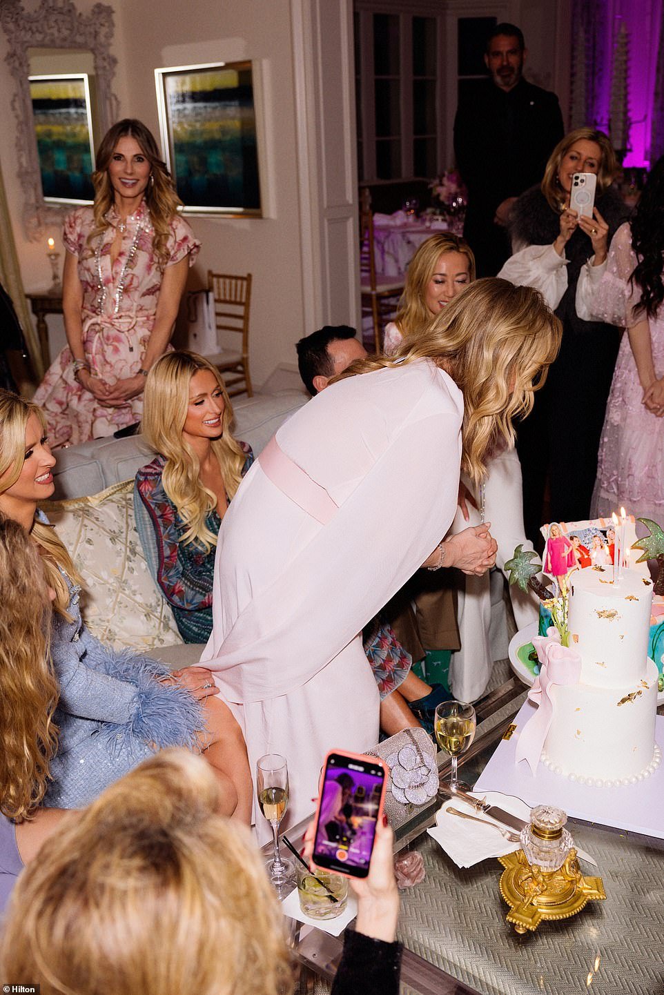 The reality TV icon looked at her birthday cake with a photo of her in pink and an image with her girls