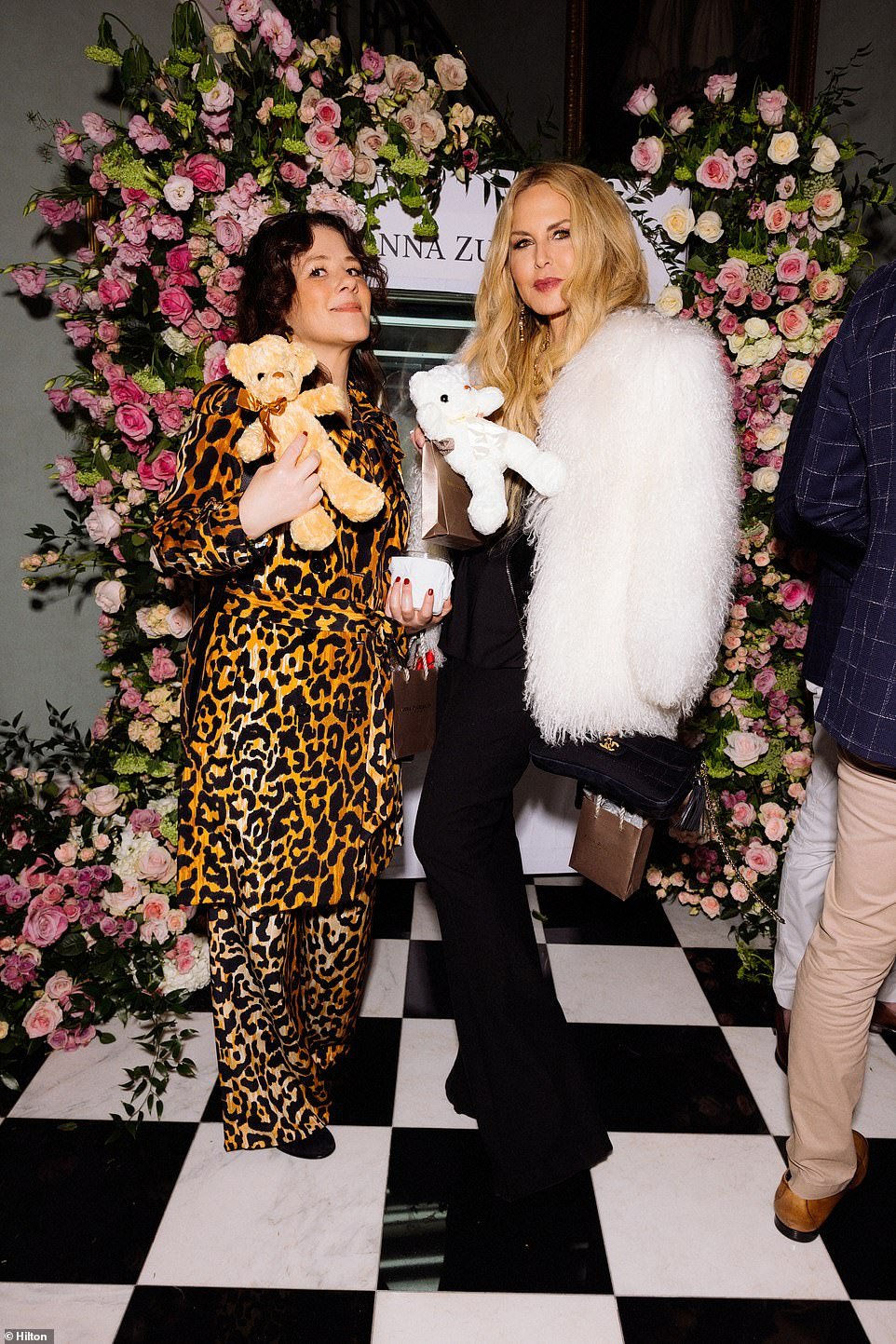 Rachel Zoe, stylist to the stars and designer, held up a bear coming out of the claw machine.  She was with Tracey Cunningham, a famous hair colorist