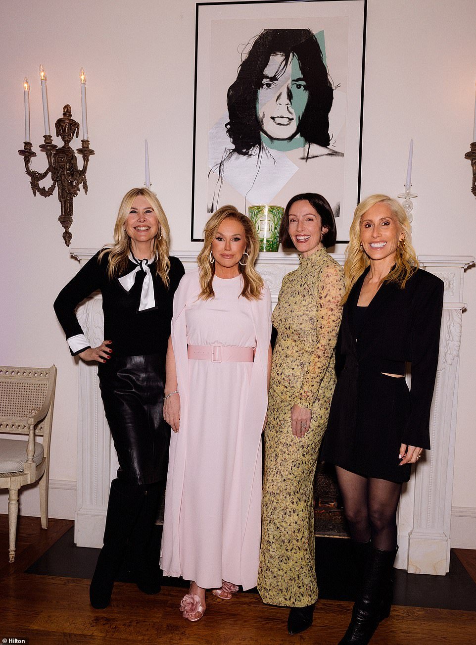 Kathy and her friends (from left) Irena, Zoe de Givenchy and Alexandra von Furstenberg stood in front of a photo of Mick Jagger