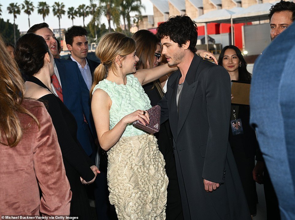 King lit up when she ran into her We Were The Lucky Ones leading man, Logan Lerman (R).