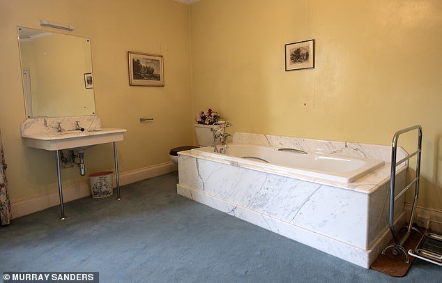 The bathroom with its large marble edges