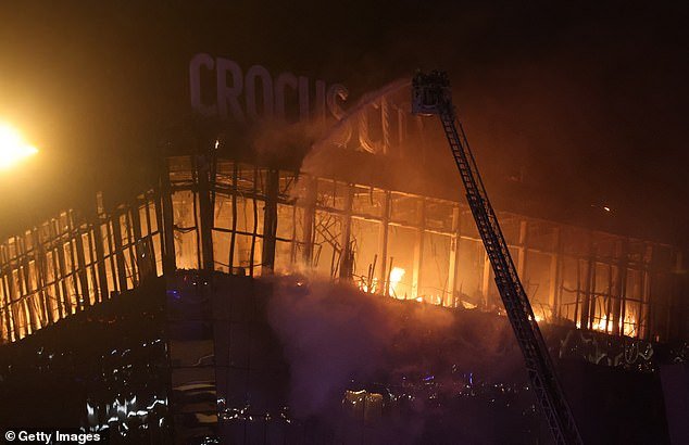 A fire rages at the Crocus City Hall in Krasnororsk, Russia