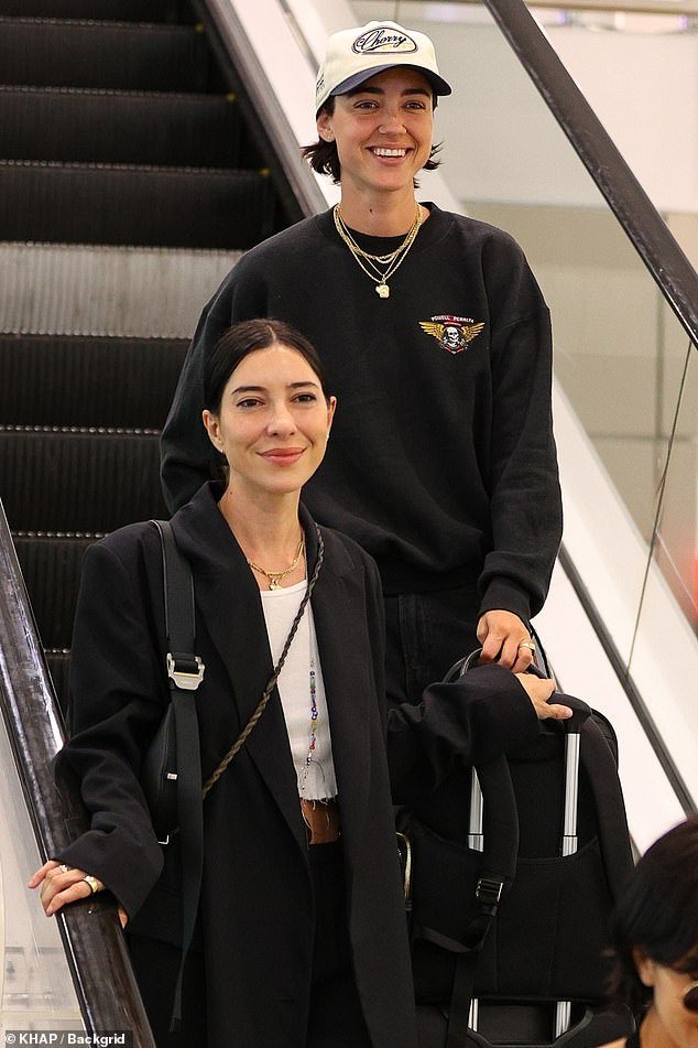 The twin singers arrived in Sydney with their partners on Saturday to launch their new album.  Pictured: Jessica Origliasso and fiancé Alex Smith