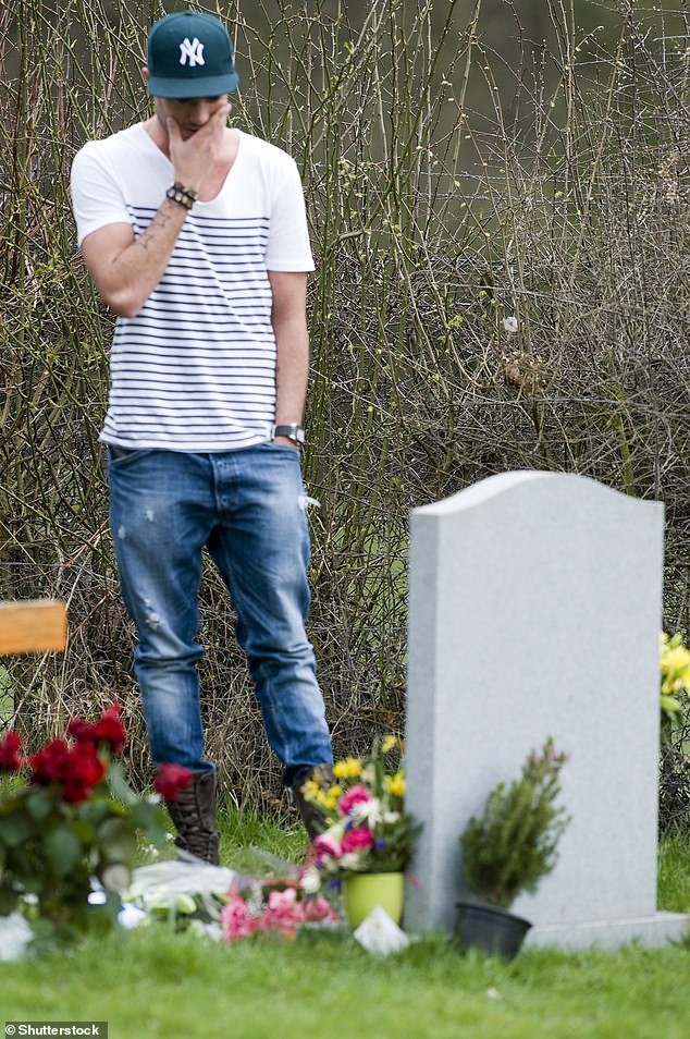 Following Jade's death two years later, he suffered major depression and turned to alcohol (pictured visiting Jade's grave in 2011)