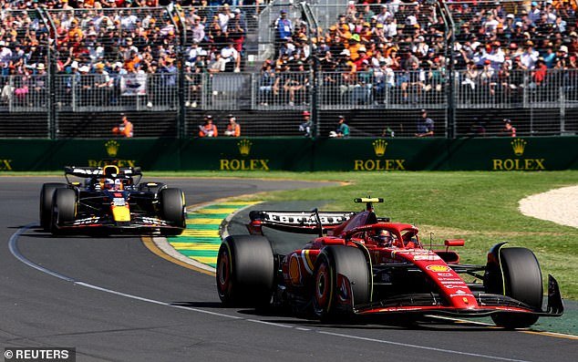 Ferrari's Carlos Sainz passed the world champion on the second lap (pictured) - just before Verstappen said the car was 'loose' and then added: 'fire, fire!'  while the flames lapped at the back