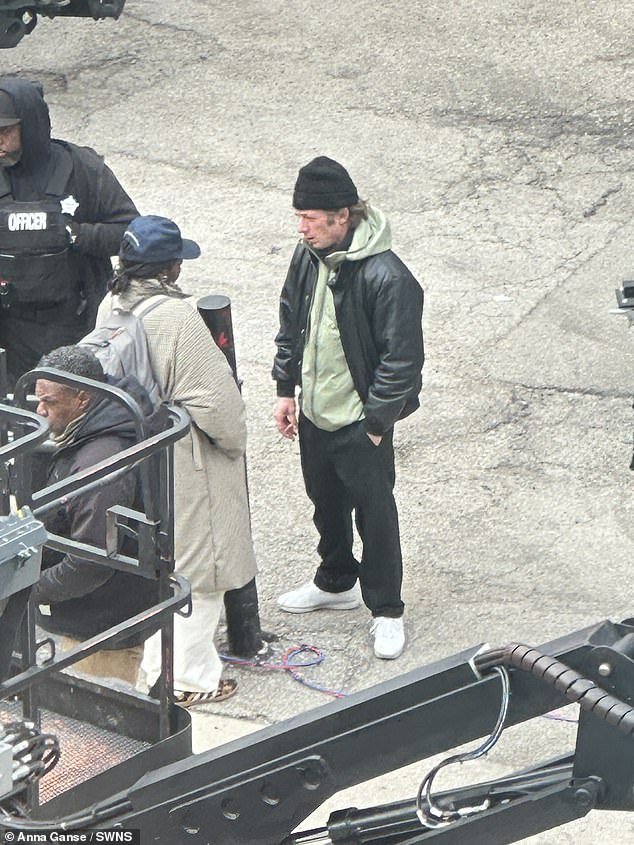 The Brooklyn native, who wore a black beanie and a green windbreaker under a black leather jacket for warmth, held a cigarette in his hand during one scene