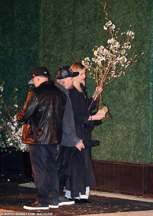 Four-time Golden Globe nominee Cameron Diaz – who is in the midst of a Hollywood comeback – held a branch of flowers next to her husband Benji Madden, with whom she just welcomed her second child (son Cardinal) via surrogate
