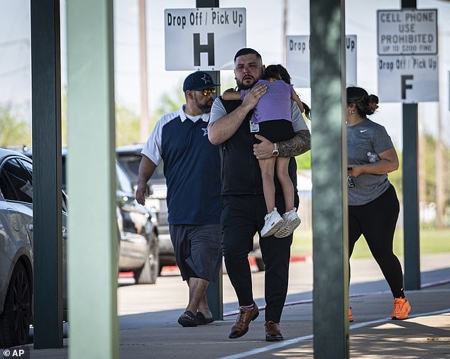 Families reunite with their children at Tom Green Elementary in Buda, Texas, after the school's pre-K students were involved in a bus crash on Texas State Highway 21 near Caldwell Road in Bastrop, Texas on Friday, March 22, 2024