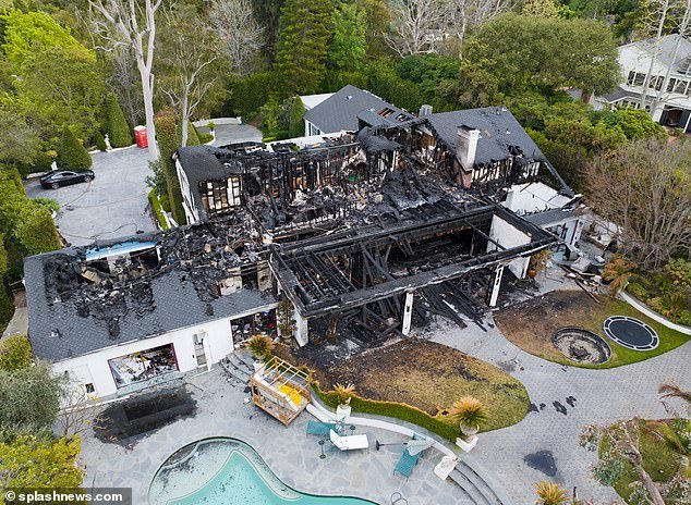 Aerial photos show the $7 million property reduced to a pile of wreckage after a fire caused by an electrical problem