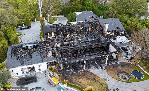 Much of the roof of Cara's house was destroyed by the fire, and the kitchen and bedrooms are now fully visible from the air