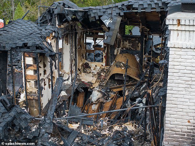 The fire is believed to have started in a back room of the building.  Images obtained by DailyMail.com show that entire parts of the roof have now collapsed as a result of the fire